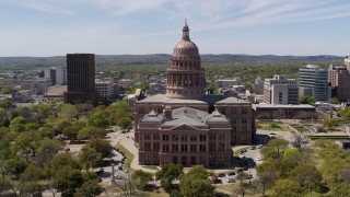 DX0002_107_013 - 5.7K stock footage aerial video ascend over library for view of Texas State Capitol in Downtown Austin, Texas