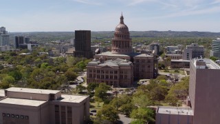 DX0002_107_018 - 5.7K aerial stock footage approach the Texas State Capitol dome from library and orbit in Downtown Austin, Texas