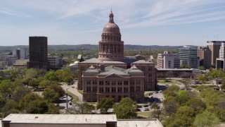 DX0002_107_020 - 5.7K aerial stock footage fly over library and approach the Texas State Capitol building in Downtown Austin, Texas