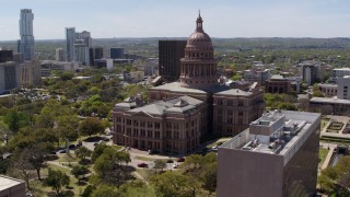 DX0002_107_022 - 5.7K aerial stock footage of circling the Texas State Capitol building in Downtown Austin, Texas