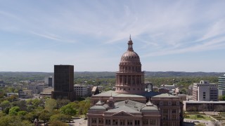 DX0002_107_026 - 5.7K aerial stock footage of orbiting around the dome of Texas State Capitol, Downtown Austin, Texas