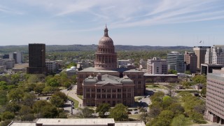 DX0002_107_029 - 5.7K aerial stock footage fly over library toward Texas State Capitol, Downtown Austin, Texas