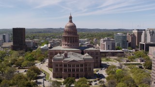 DX0002_107_030 - 5.7K aerial stock footage descending while focused on the Texas State Capitol, Downtown Austin, Texas