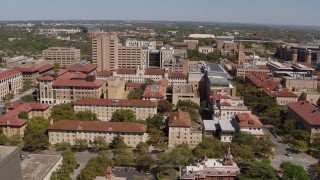 DX0002_107_046 - 5.7K aerial stock footage of slowly passing campus buildings at the University of Texas, Austin, Texas
