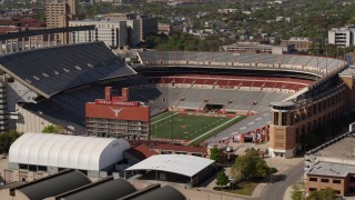 DX0002_108_023 - 5.7K aerial stock footage of a view of the empty football stadium at the University of Texas, Austin, Texas