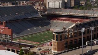DX0002_108_025 - 5.7K aerial stock footage ascend to focus on the empty football stadium at the University of Texas, Austin, Texas
