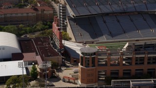 DX0002_108_027 - 5.7K aerial stock footage orbit scoreboard at the empty football stadium at the University of Texas, Austin, Texas