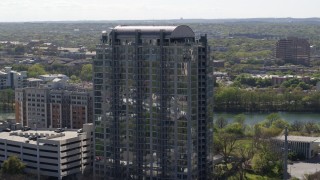 DX0002_108_034 - 5.7K aerial stock footage of orbiting a high-rise apartment building in Downtown Austin, Texas