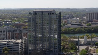 DX0002_108_035 - 5.7K aerial stock footage of slowly orbiting a high-rise apartment building in Downtown Austin, Texas