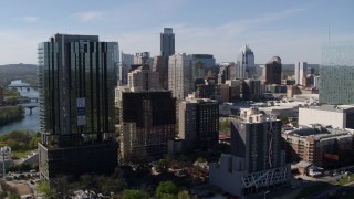DX0002_108_042 - 5.7K aerial stock footage of a view of the towering city skyline during descent in Downtown Austin, Texas