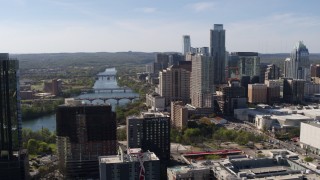 DX0002_108_044 - 5.7K aerial stock footage ascend for a view of the city's skyline and Lady Bird Lake in Downtown Austin, Texas