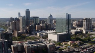 DX0002_108_049 - 5.7K aerial stock footage of a high-rise hotel and the city's skyline in Downtown Austin, Texas