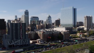 DX0002_108_051 - 5.7K aerial stock footage of the city's skyline and high-rise hotel seen from freeway in Downtown Austin, Texas