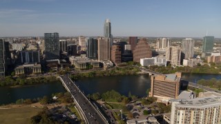 DX0002_109_021 - 5.7K aerial stock footage stationary view of the city's waterfront skyline and First Street Bridge, Downtown Austin, Texas