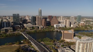 DX0002_109_024 - 5.7K aerial stock footage part of the city's waterfront skyline, and First Street Bridge over Lady Bird Lake, Downtown Austin, Texas