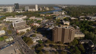 DX0002_109_028 - 5.7K aerial stock footage of two busy street intersections between hotel and office complex, Austin, Texas
