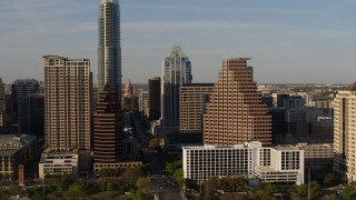 DX0002_109_033 - 5.7K aerial stock footage flyby downtown skyscrapers and reveal the state capitol in Downtown Austin, Texas