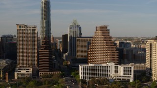 DX0002_109_035 - 5.7K aerial stock footage passing downtown skyscrapers and reveal the state capitol in Downtown Austin, Texas