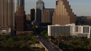 DX0002_109_037 - 5.7K aerial stock footage of downtown skyscrapers during descent, reveal bridge in Downtown Austin, Texas