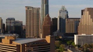 DX0002_109_040 - 5.7K aerial stock footage of downtown skyscrapers seen during ascent in Downtown Austin, Texas