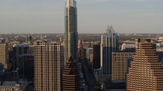 DX0002_109_042 - 5.7K aerial stock footage fly between downtown skyscrapers, reveal Texas State Capitol in Downtown Austin, Texas