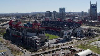 DX0002_112_011 - 5.7K aerial stock footage of an orbit of the football stadium with view of the field in Nashville, Tennessee