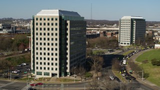 DX0002_113_045 - 5.7K aerial stock footage of orbiting a government office building to reveal a second building in Downtown Nashville, Tennessee