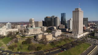 DX0002_114_009 - 5.7K aerial stock footage descend and orbit Tennessee State Capitol, skyscrapers, Tennessee Tower in Downtown Nashville, Tennessee