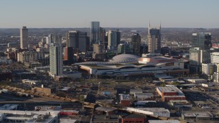 DX0002_114_016 - 5.7K aerial stock footage of passing by the convention center and skyline in Downtown Nashville, Tennessee