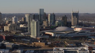 DX0002_114_031 - 5.7K aerial stock footage descent, and stationary view of city skyline and the convention center in Downtown Nashville, Tennessee
