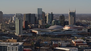 DX0002_114_033 - 5.7K aerial stock footage descending with view of city skyline and the convention center in Downtown Nashville, Tennessee