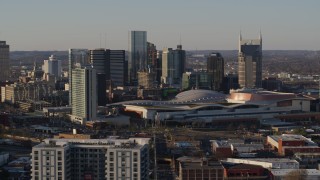 DX0002_114_041 - 5.7K aerial stock footage slow flight by city's tall skyline, Nashville Music City Center in Downtown Nashville, Tennessee