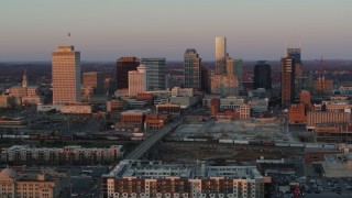 DX0002_115_007 - 5.7K aerial stock footage of passing by the city's skyline at sunset in Downtown Nashville, Tennessee
