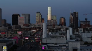 DX0002_115_023 - 5.7K aerial stock footage flashing lights on Church Street and view of city's skyline at twilight in Downtown Nashville, Tennessee