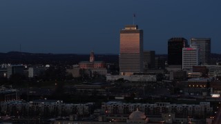 DX0002_115_029 - 5.7K aerial stock footage of the State Capitol and skyscraper at twilight in Downtown Nashville, Tennessee