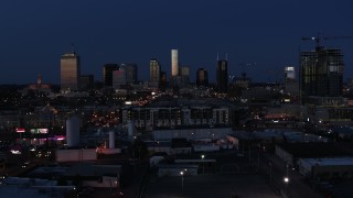 DX0002_115_032 - 5.7K aerial stock footage wide view of skyscrapers reflecting light in the city skyline at twilight in Downtown Nashville, Tennessee