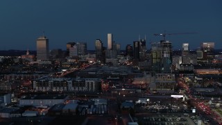 DX0002_115_033 - 5.7K aerial stock footage wide view of the city skyline and high-rise under construction at twilight, Downtown Nashville, Tennessee