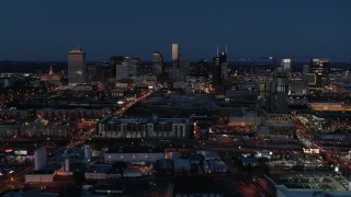 DX0002_115_038 - 5.7K aerial stock footage wide view of city skyline at twilight, near high-rise construction, Downtown Nashville, Tennessee