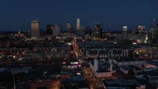 DX0002_115_039 - 5.7K aerial stock footage flashing lights and traffic on Church Street and city skyline, Downtown Nashville, Tennessee