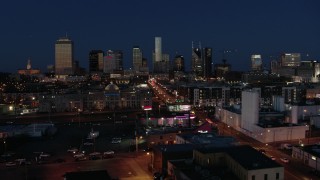 DX0002_115_040 - 5.7K aerial stock footage flashing lights and traffic on Church Street, city skyline, high-rise construction, Downtown Nashville, Tennessee
