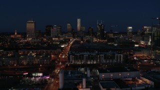 DX0002_115_042 - 5.7K aerial stock footage approach Church Street and the city skyline at twilight, Downtown Nashville, Tennessee