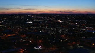 DX0002_115_046 - 5.7K aerial stock footage slowly circling a hospital complex at twilight while ascending, Nashville, Tennessee