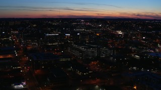DX0002_115_048 - 5.7K aerial stock footage slowly flying away from a hospital complex at twilight, Nashville, Tennessee