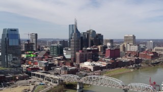 DX0002_116_014 - 5.7K aerial stock footage approach AT&T Building near bridge and Cumberland River in Downtown Nashville, Tennessee
