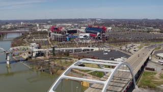 DX0002_116_017 - 5.7K aerial stock footage of Nissan Stadium seen from a bridge in Nashville, Tennessee