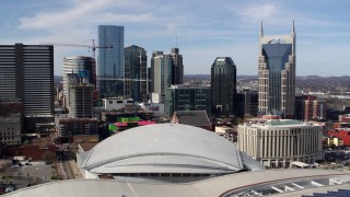 DX0002_117_050 - 5.7K aerial stock footage of the city's skyline, Bridgestone Arena, and Hilton hotel, Downtown Nashville, Tennessee