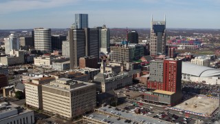 DX0002_118_014 - 5.7K aerial stock footage orbit city buildings near high-rise hotel and skyscrapers in Downtown Nashville, Tennessee