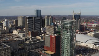 DX0002_119_001 - 5.7K aerial stock footage a reverse view of Renaissance Hotel, reveal JW Marriott hotel in Downtown Nashville, Tennessee