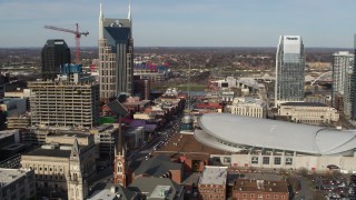 DX0002_119_006 - 5.7K aerial stock footage flyby Broadway and Bridgestone Arena in Downtown Nashville, Tennessee