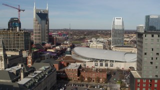 DX0002_119_009 - 5.7K aerial stock footage flyby hotel to reveal Broadway and Bridgestone Arena, Downtown Nashville, Tennessee